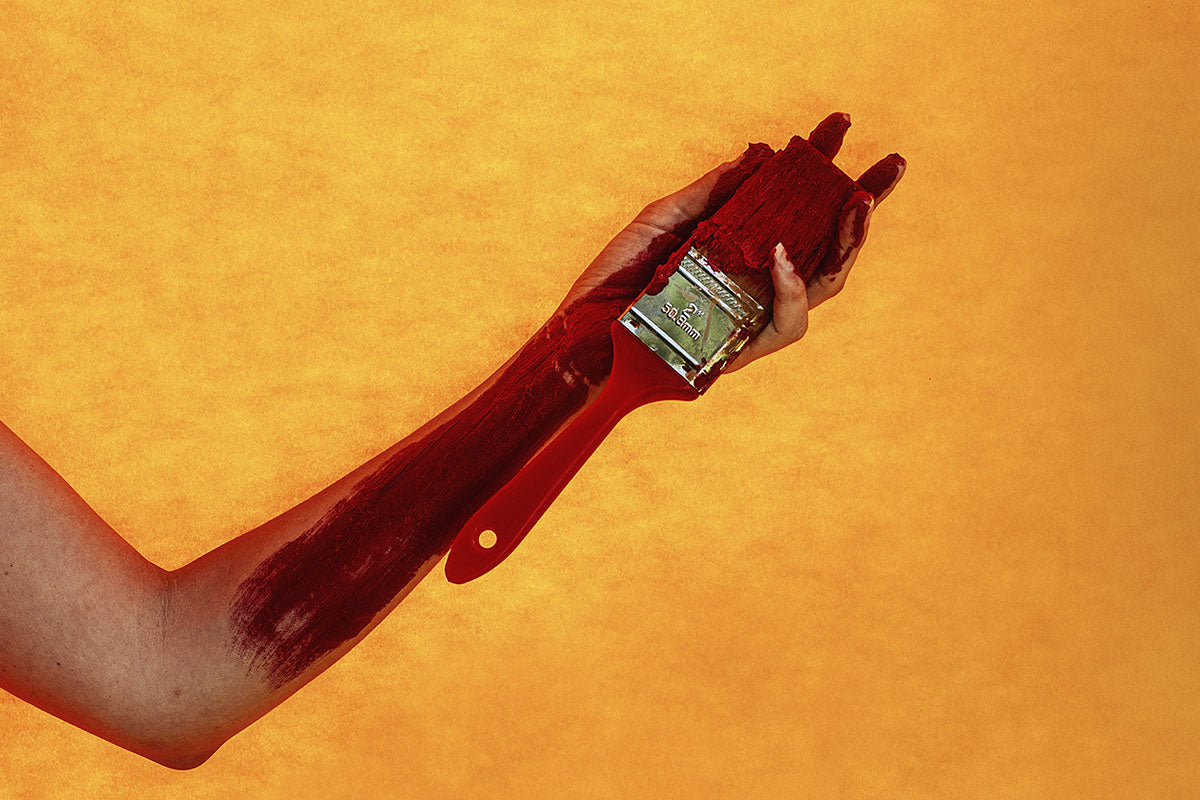 Red Paint Brush On Textured Background Blog image