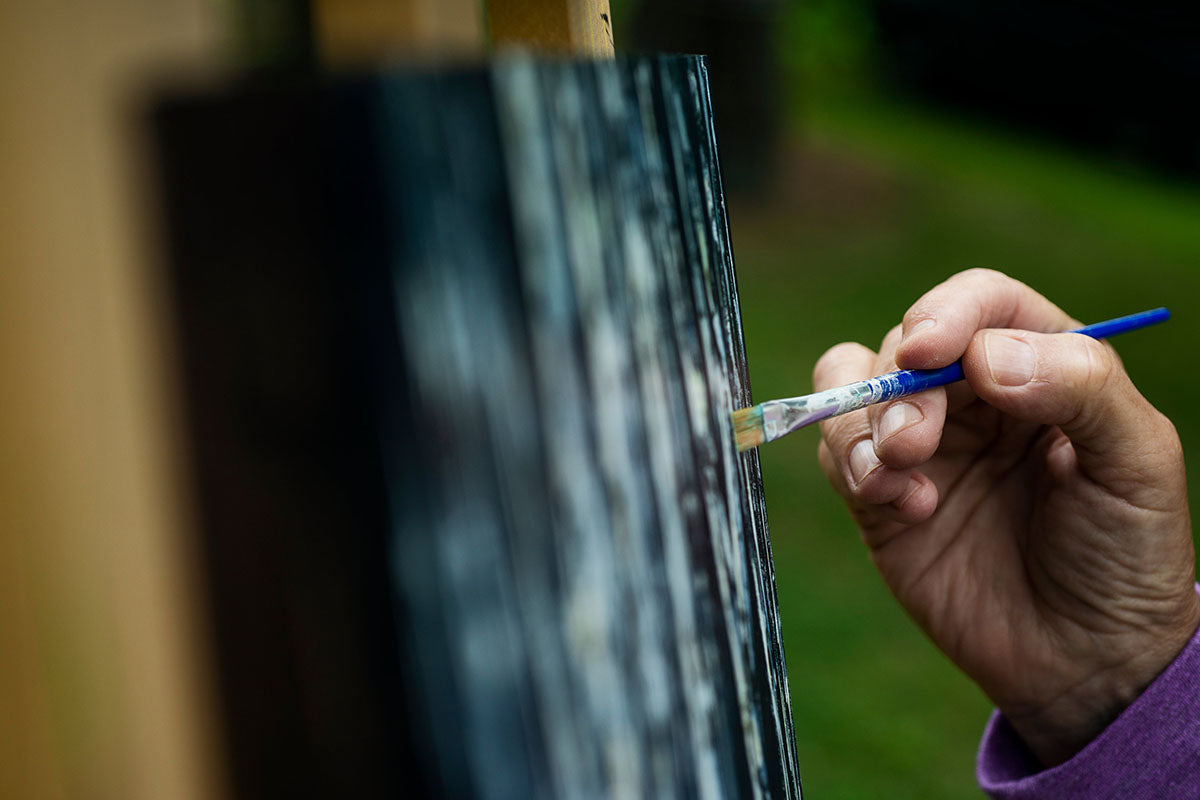 Hand Holding a Fine Paint Brush To a Painting SenroArt
