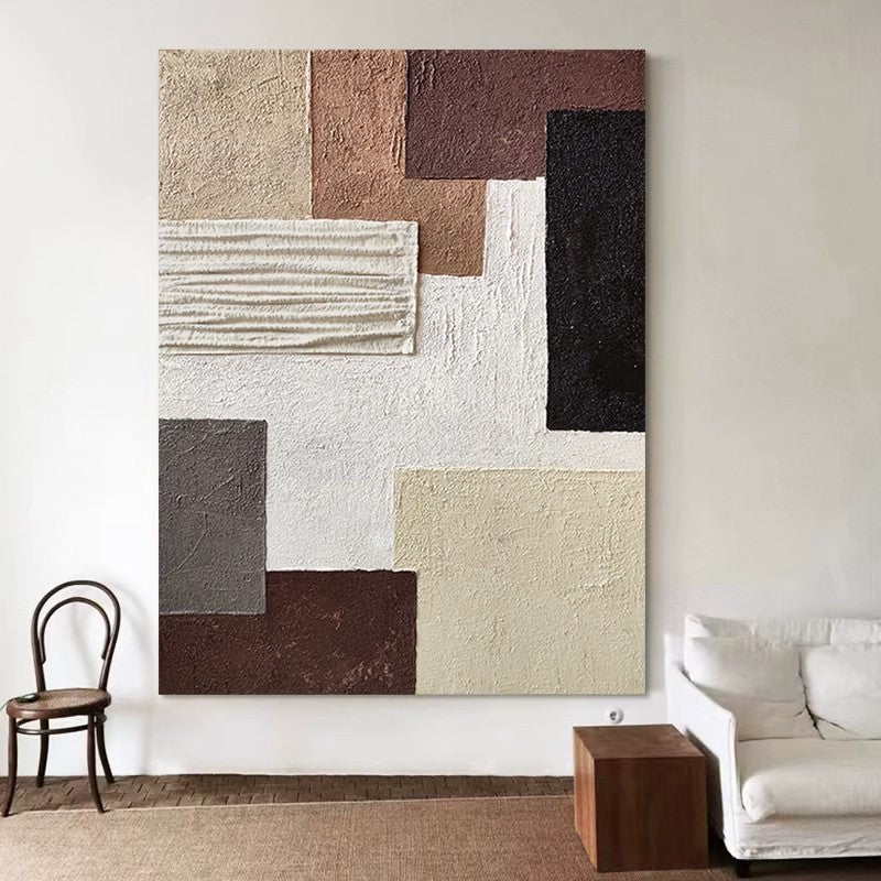 Artistic color blocks for simple hanging paintings next to white sofas and chairs