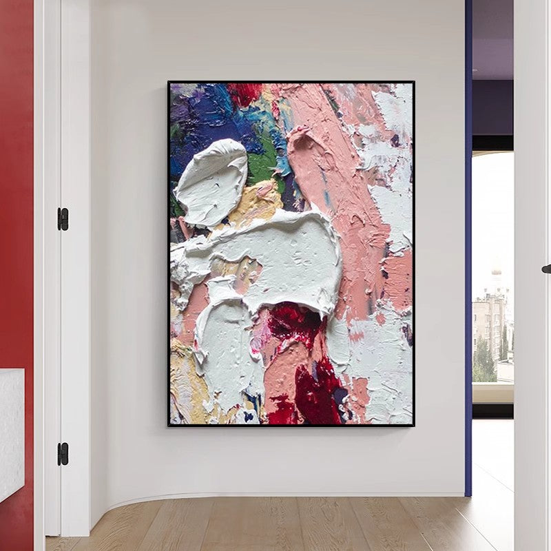 Colorful paintings in black environmentally friendly frames on the walls of the room corridor