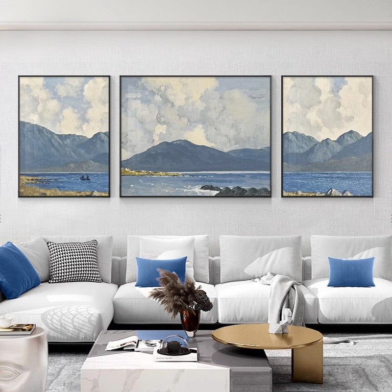 Three blue landscape paintings hanging on the sofa wall in the living room SenroArt