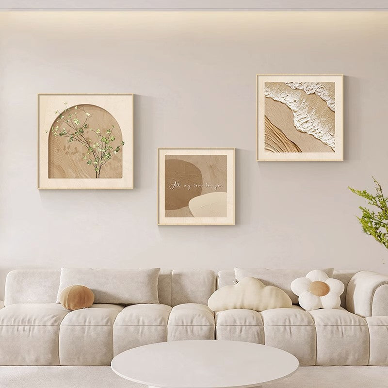Three paintings behind the sofa in the wabi-sabi style living room SenroArt